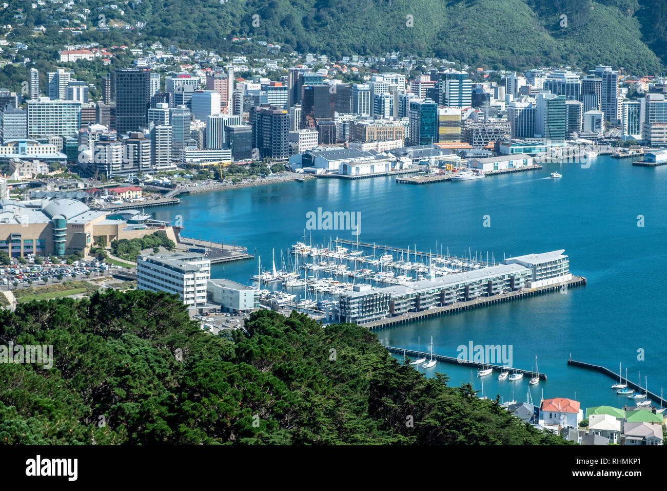 View over Wellington Bay, with marina in foreground and business district and hills in background, Wellington, New Zealand Stock Photo