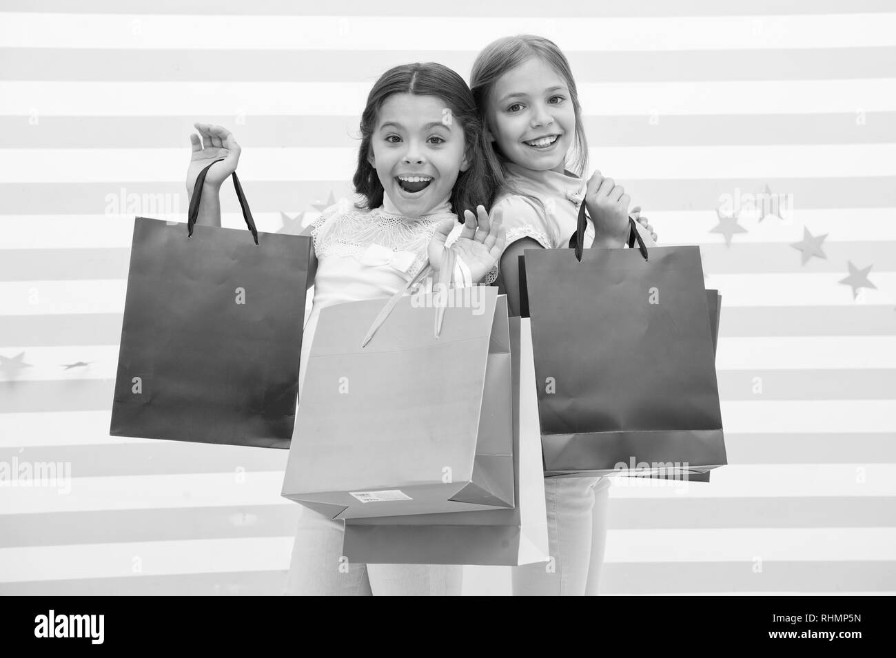 sale. happy little girl bought a lot on big sale. little girls on