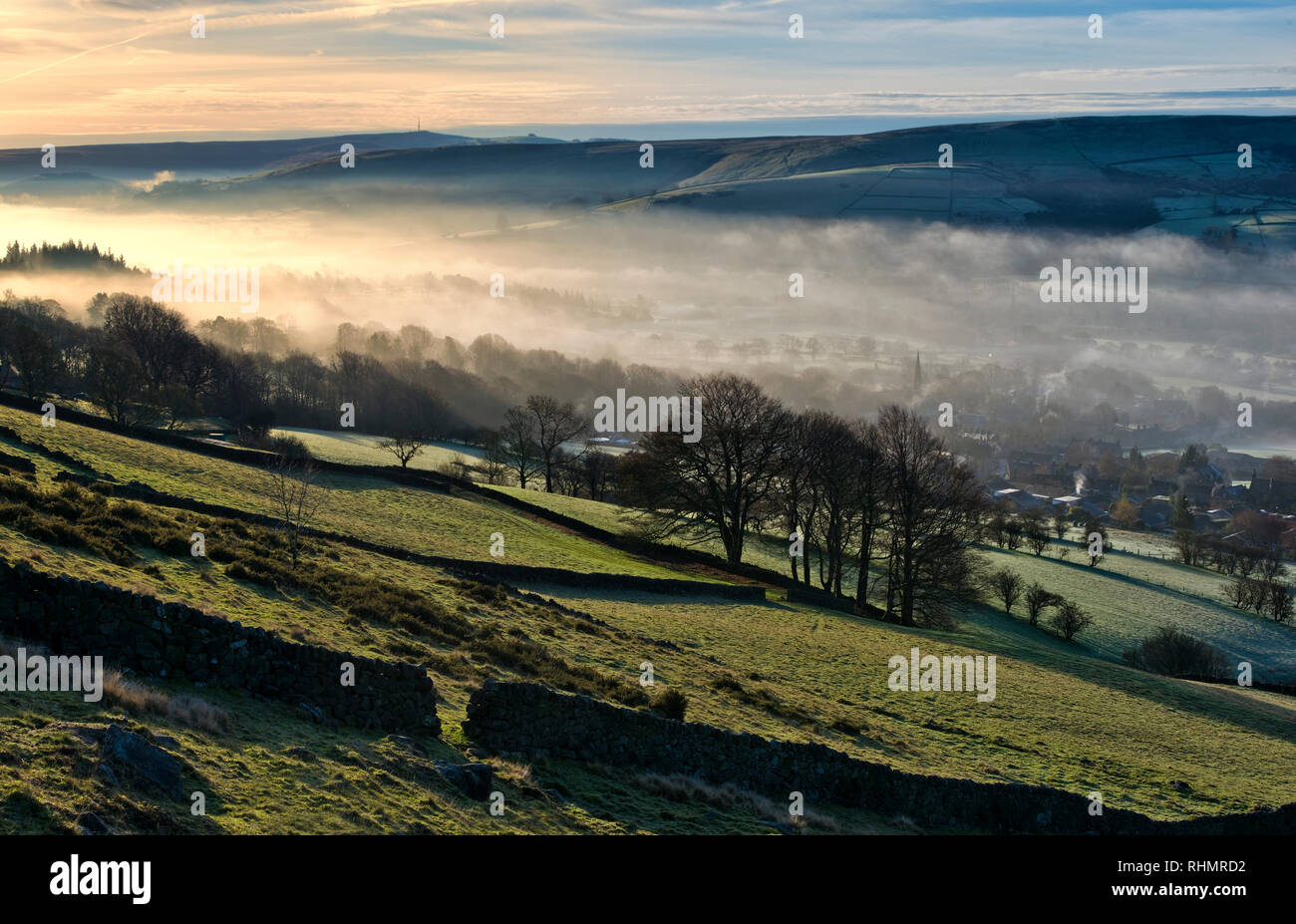 Bamford village shrouded in a mist inversion, from New Road below Bamford edge (7) Stock Photo