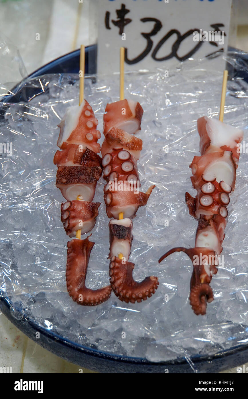Japanese food. Octopus skewer on ice. Photographed in Osaka Food Market