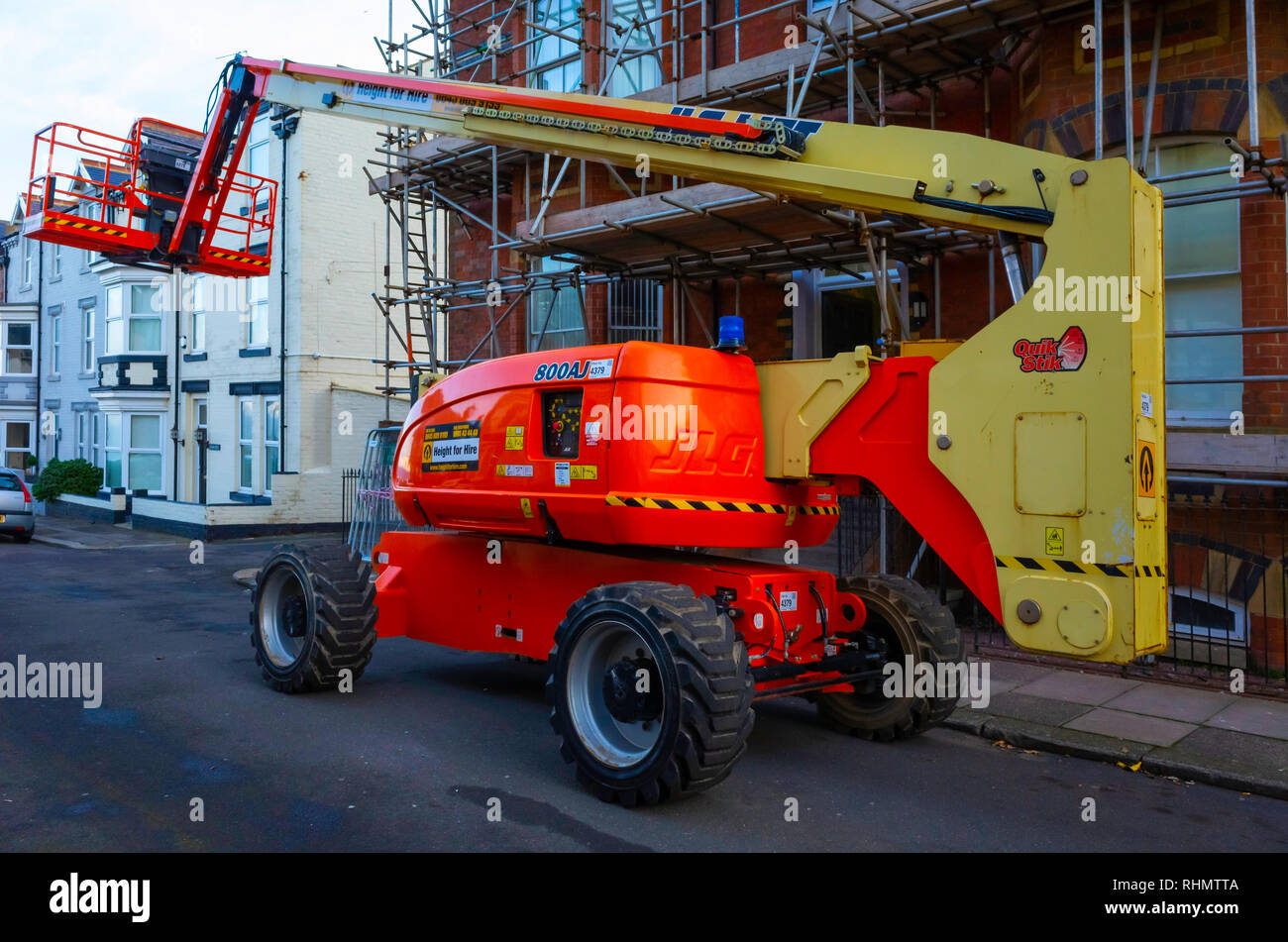 Height for Hire a JLG type 800 AJ mobile hydraulic personnel hoist working on a multi story Victorian building refurbishment Stock Photo