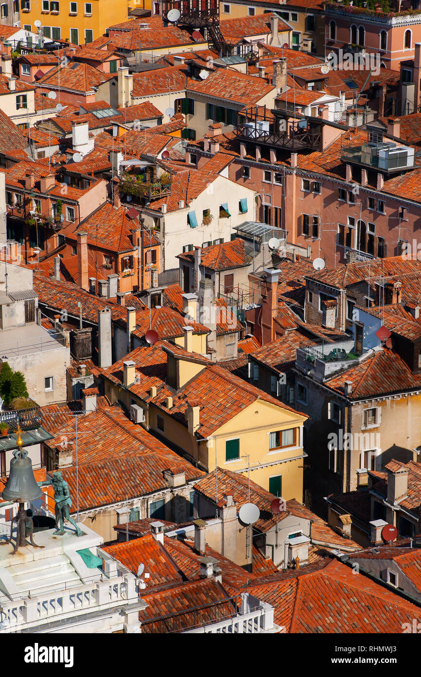View from the Campanille tower to the red and orange Venice rooftop cityscape Stock Photo