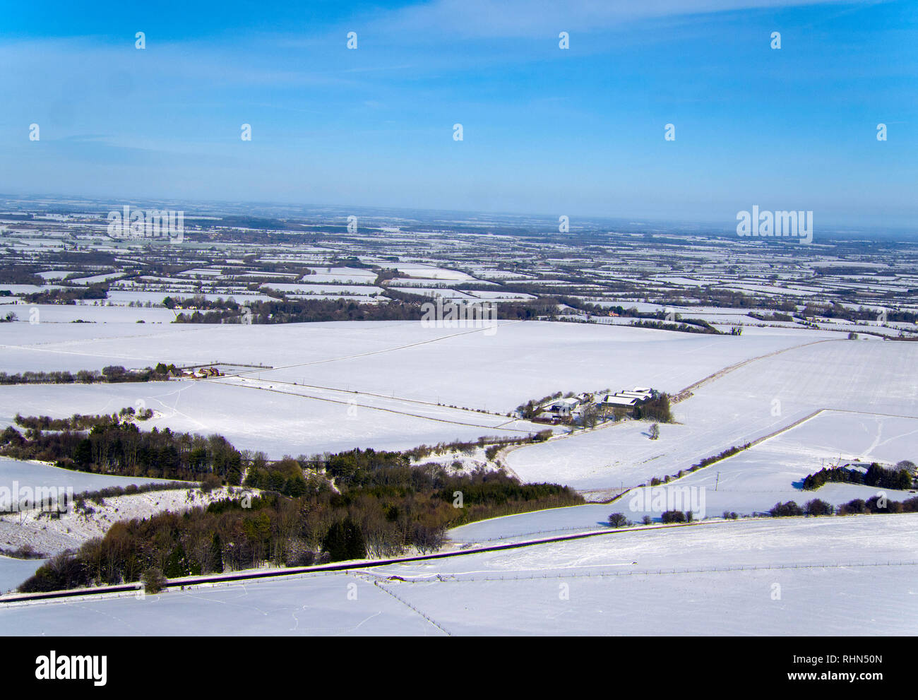 A drone photo of the hills near Lambourn, Berkshire, covered in snow, as England saw the coldest night of the winter so far as temperatures tumbled across the UK. Stock Photo