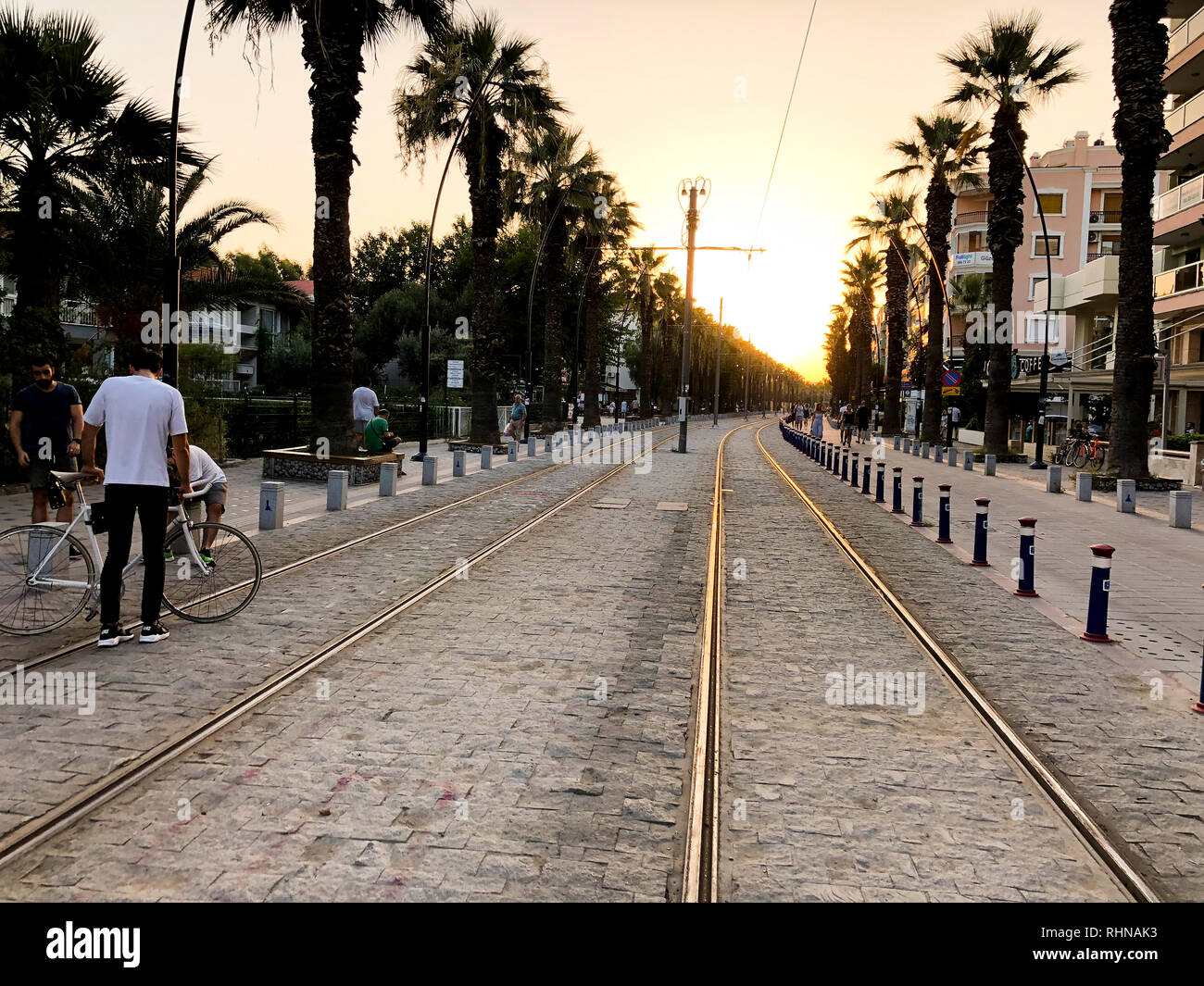 Izmir, Turkey - July 17, 2018: Rail ways of Izmir Tram at Bostanli Izmir on sunset. Stock Photo