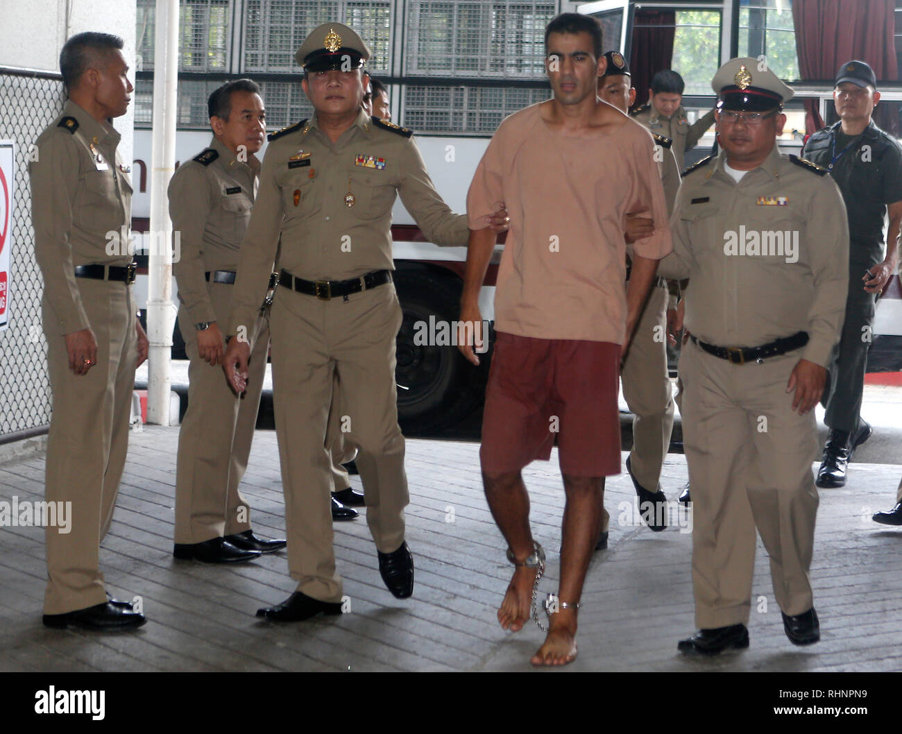 Detained Bahraini soccer player Hakeem al-Araibi is seen escorted by prison officers as he arrives at the criminal court to submit his evidence to fight against his extradition, after a local prosecutor submitted Bahrain's extradition request for him. Stock Photo