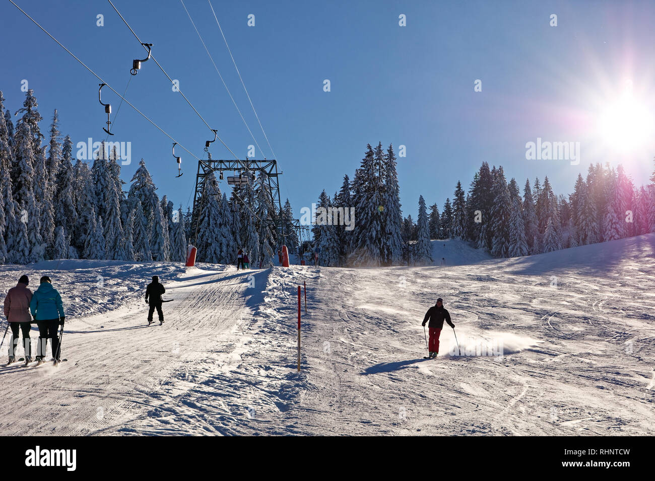 Skiers enjoying sunny day at Boedele Ski Resort - Dornbirn, Vorarlberg ...
