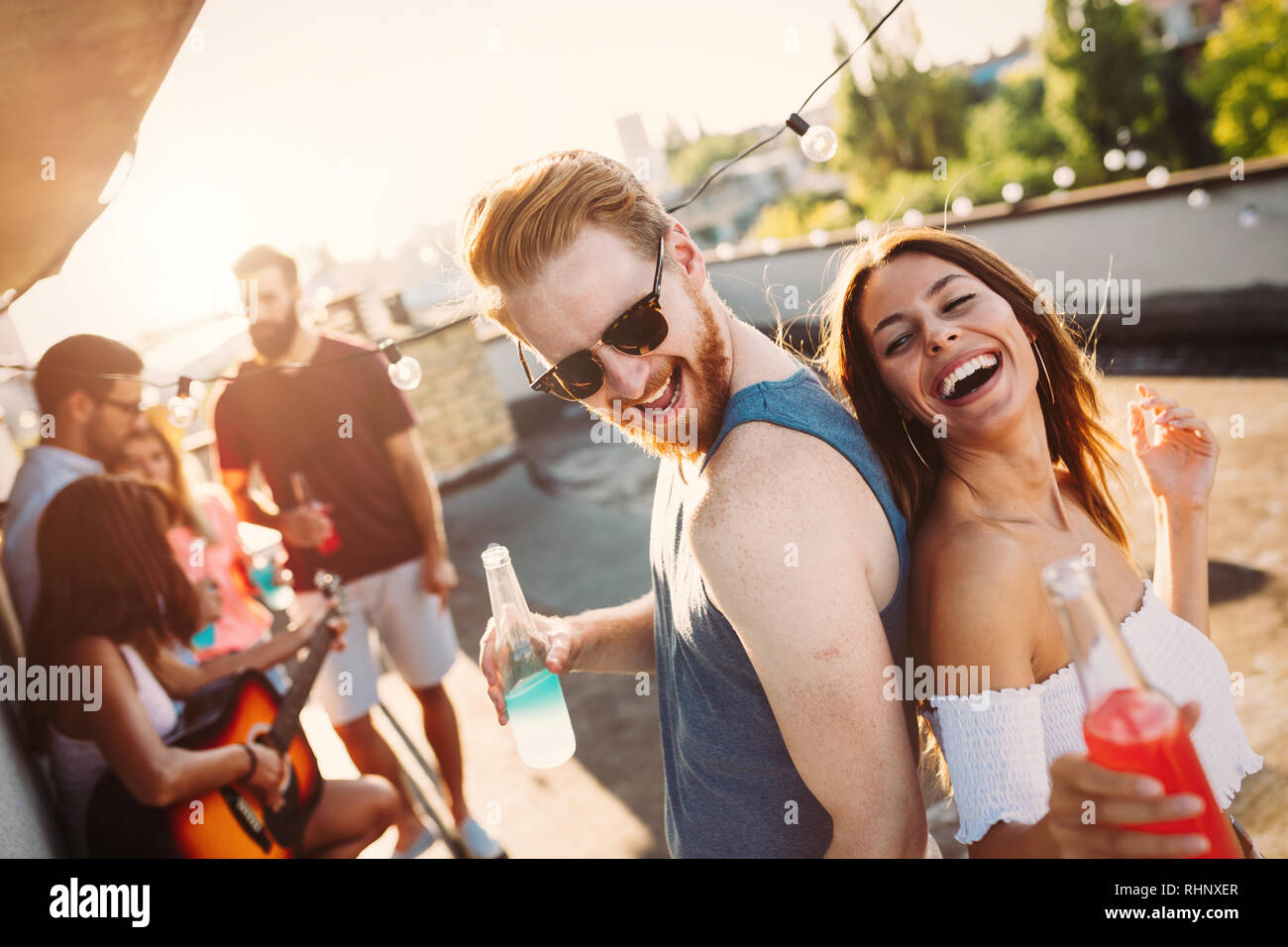 Happy couple having fun time at party Stock Photo