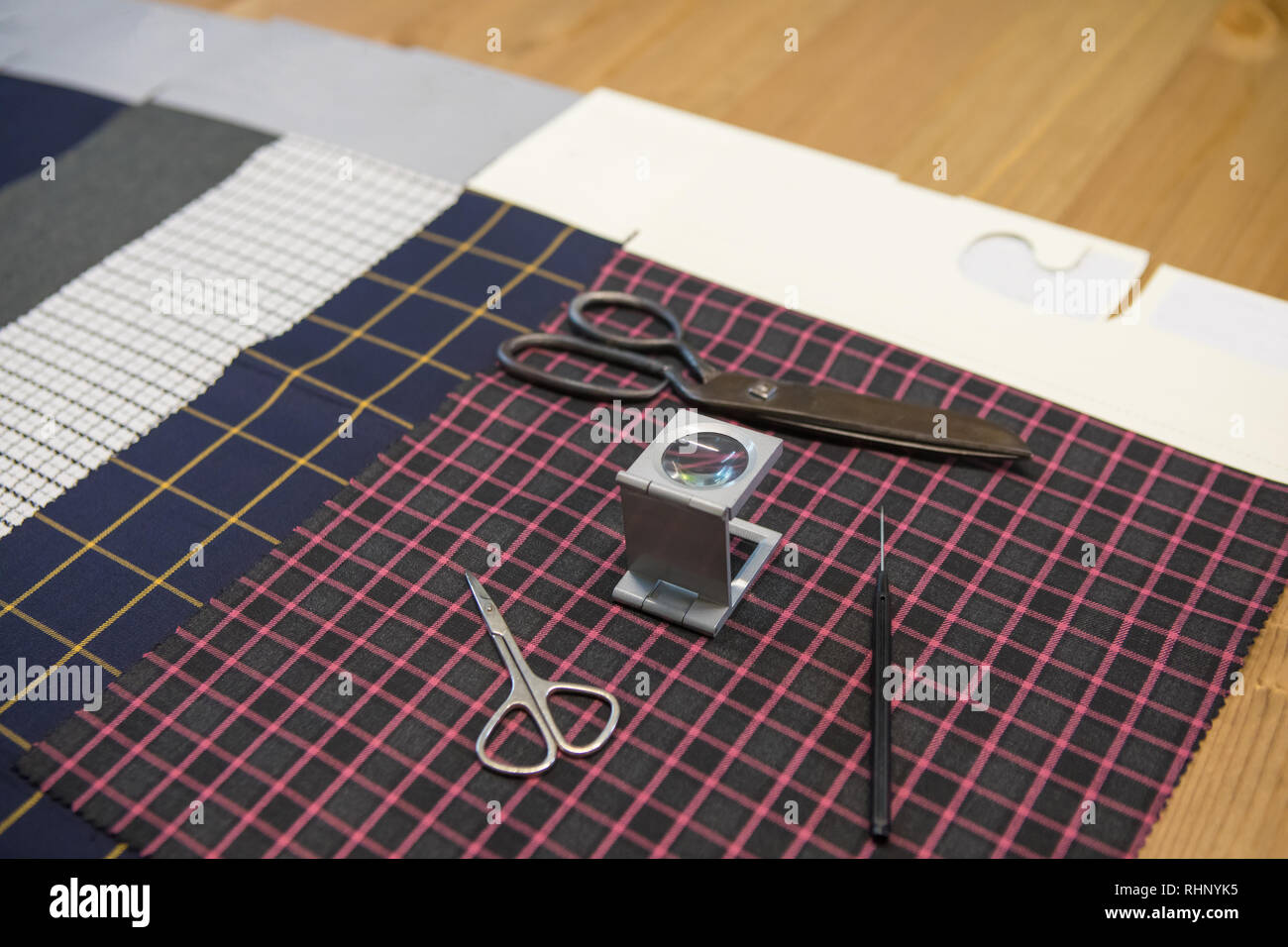 Textile industry concept background image with textile tools and products. Scissors and fabrics