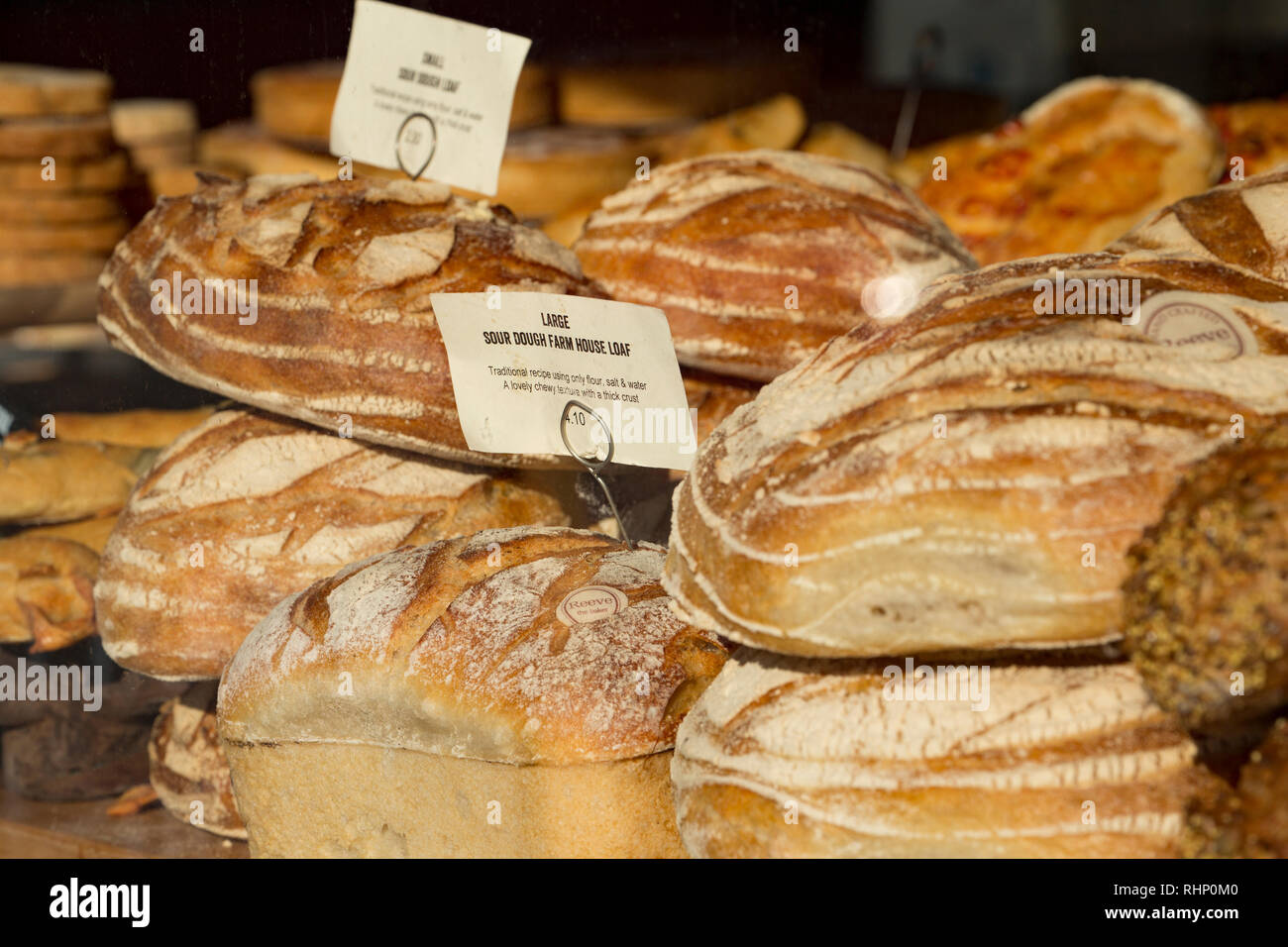 Sour dough bread for sale in the window of a Reeve The baker shop. Shaftesbury, North Dorset England UK GB Stock Photo
