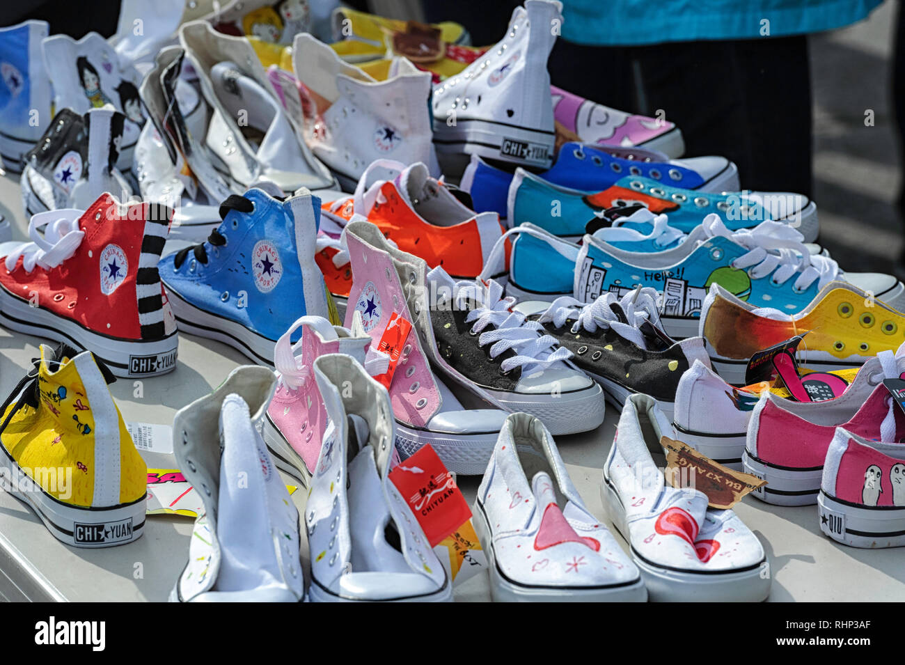 A table of  funky athletic shoes footwear sneakers for sale Stock Photo