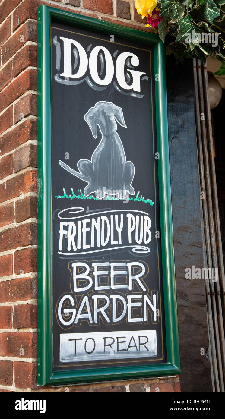 Chalkboard sign outside a public house indicating a dog friendly pub with beer garden Wallasey Village February 2019 Stock Photo