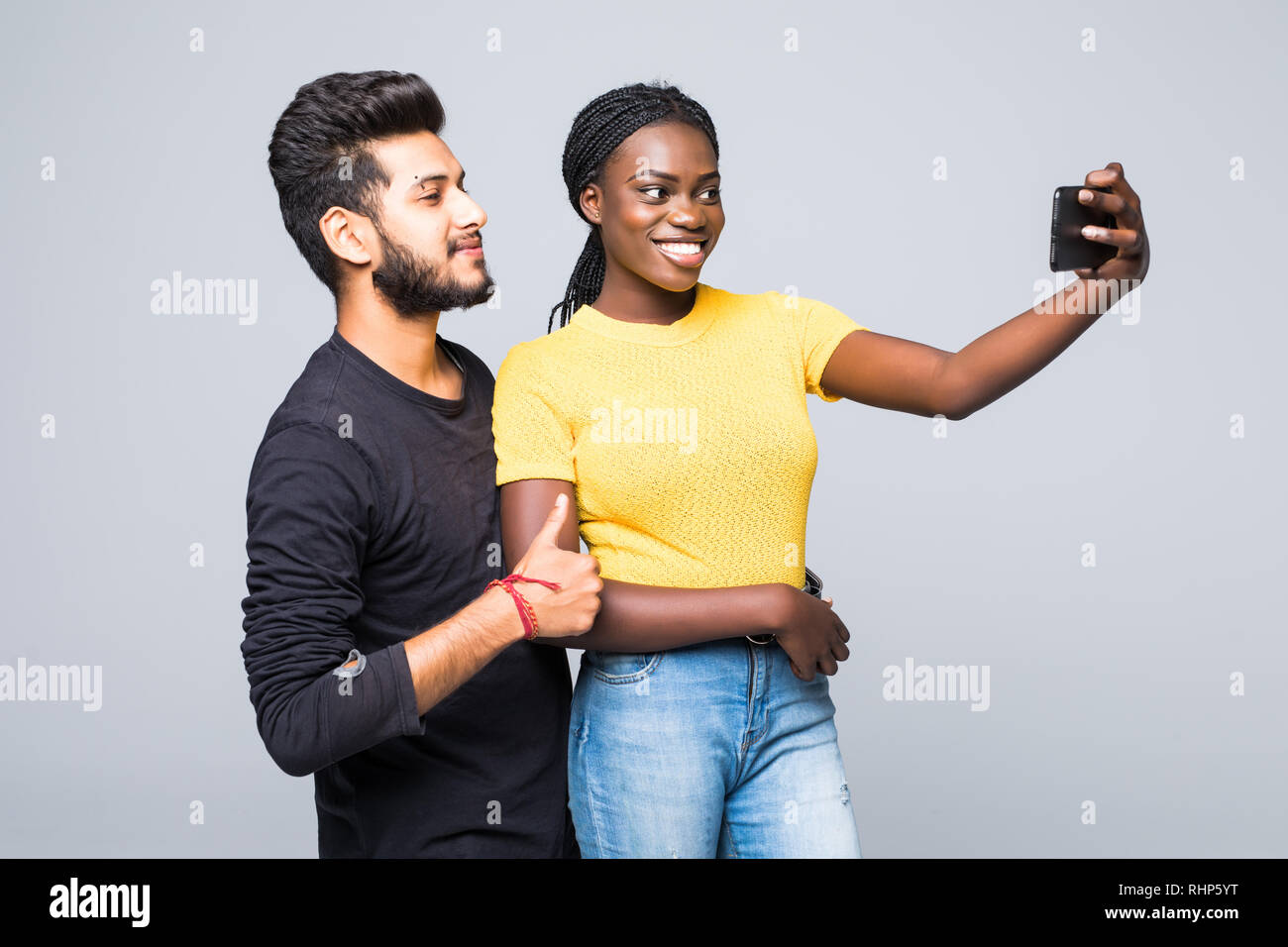 Young Interracial Couple Indian Man And African Woman Taking Selfie On