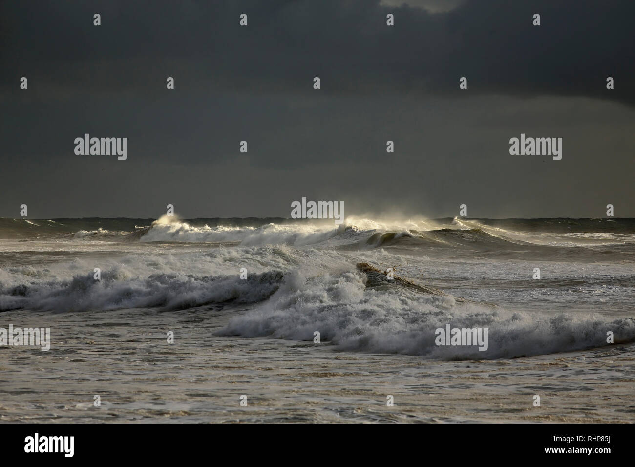 Long stormy sea wave against dark sky Stock Photo - Alamy