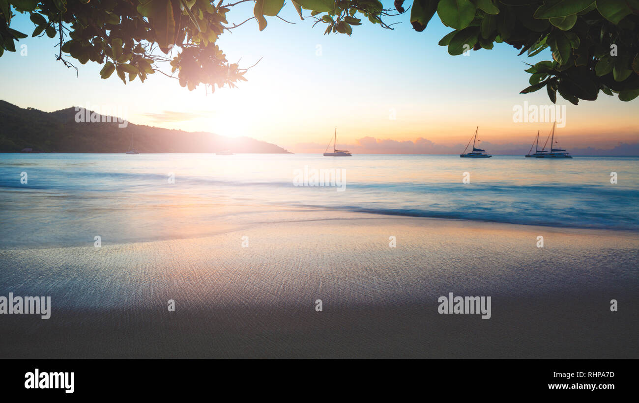 Art Beautiful sunset over the tropical beach Stock Photo - Alamy