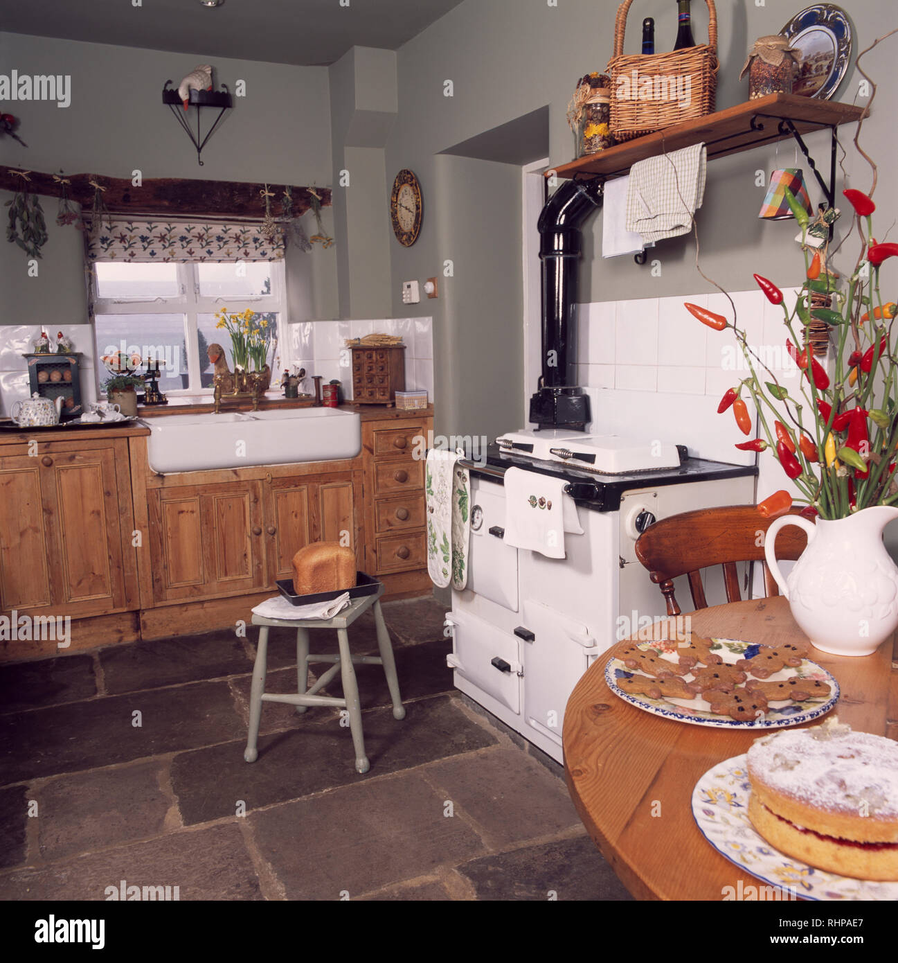 White Aga In Grey Cottage Kitchen With Slate Flooring Stock Photo Alamy