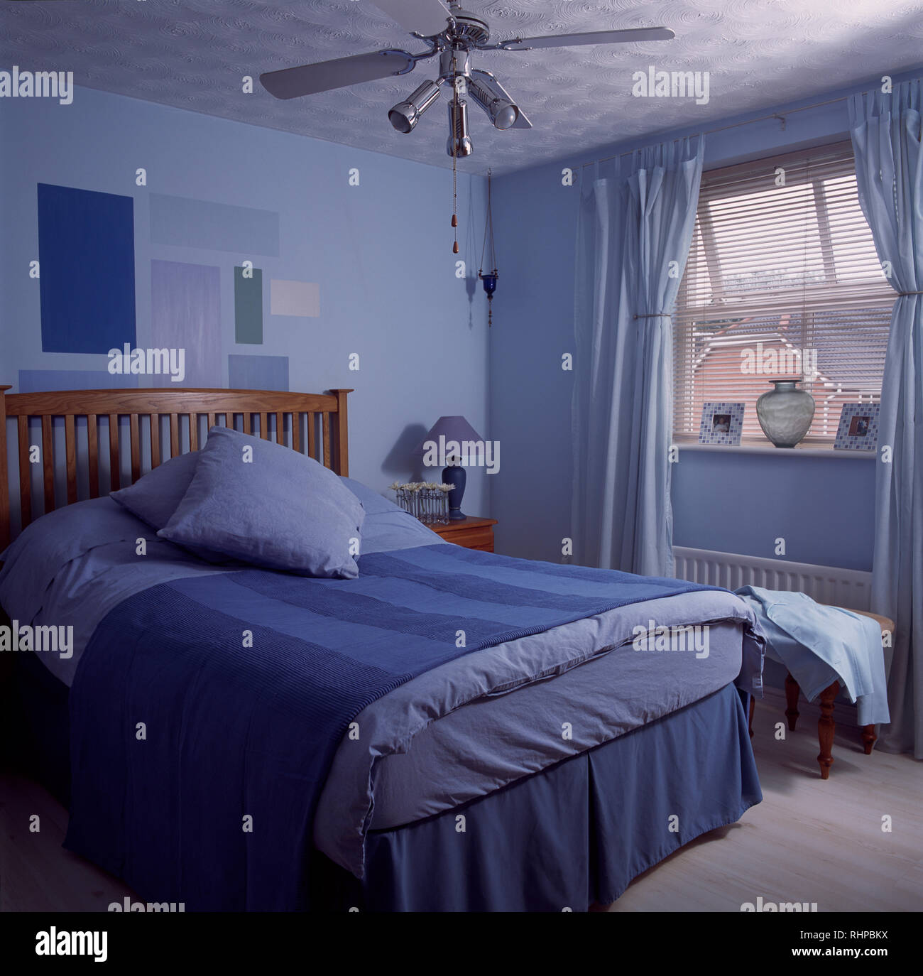 Blue bed linen in allblue bedroom Stock Photo Alamy
