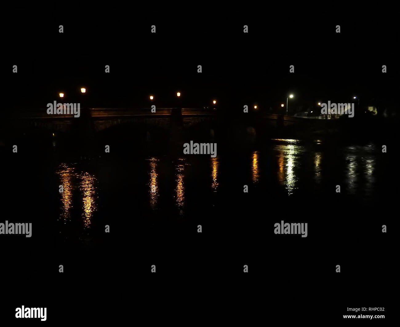 2019 - Night scene in Newton Stewart, Scotland - The bridge over the river Cree to Minnigaff (in background) was designed by John Rennie the Elder. Whilst on a pilgrimage to the shrine of St Ninian at Whithorn in 1329  Robert the Bruce forded the river where this bridge stands. The town was briefly named Newton Douglas and is presently twinned with Marcoussis, France. The horror film The Wicker Man was filmed almost entirely in the area Stock Photo