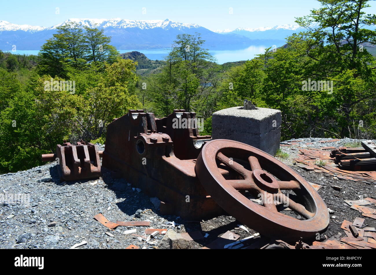 Rusty industrial machinery at Mina Escondida, an abandoned lead, zinc and copper mine near Puerto Guadal, Chile Stock Photo