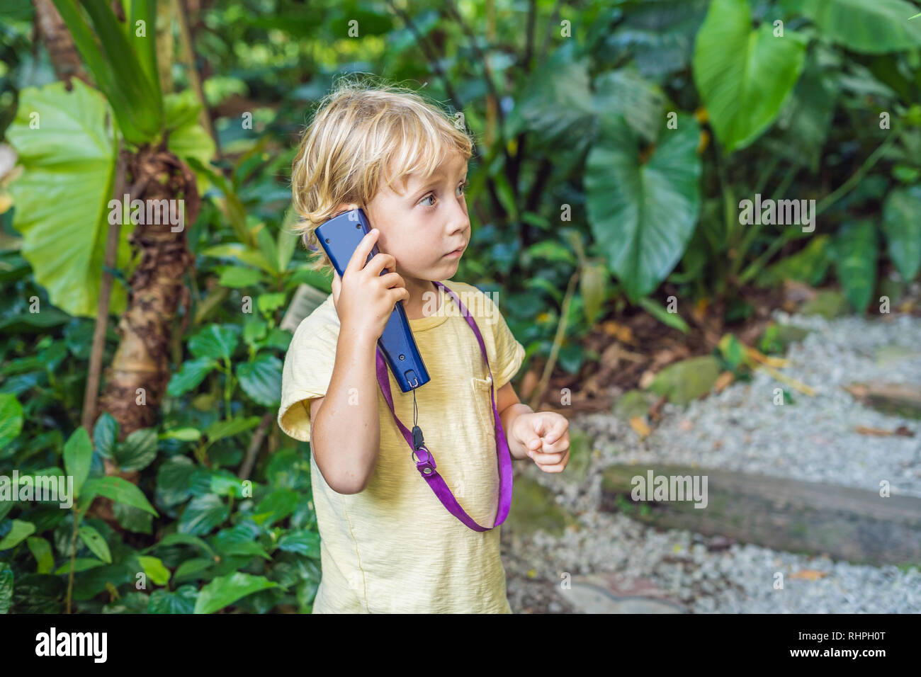Boy listens to a radio guide, tourism concept Stock Photo