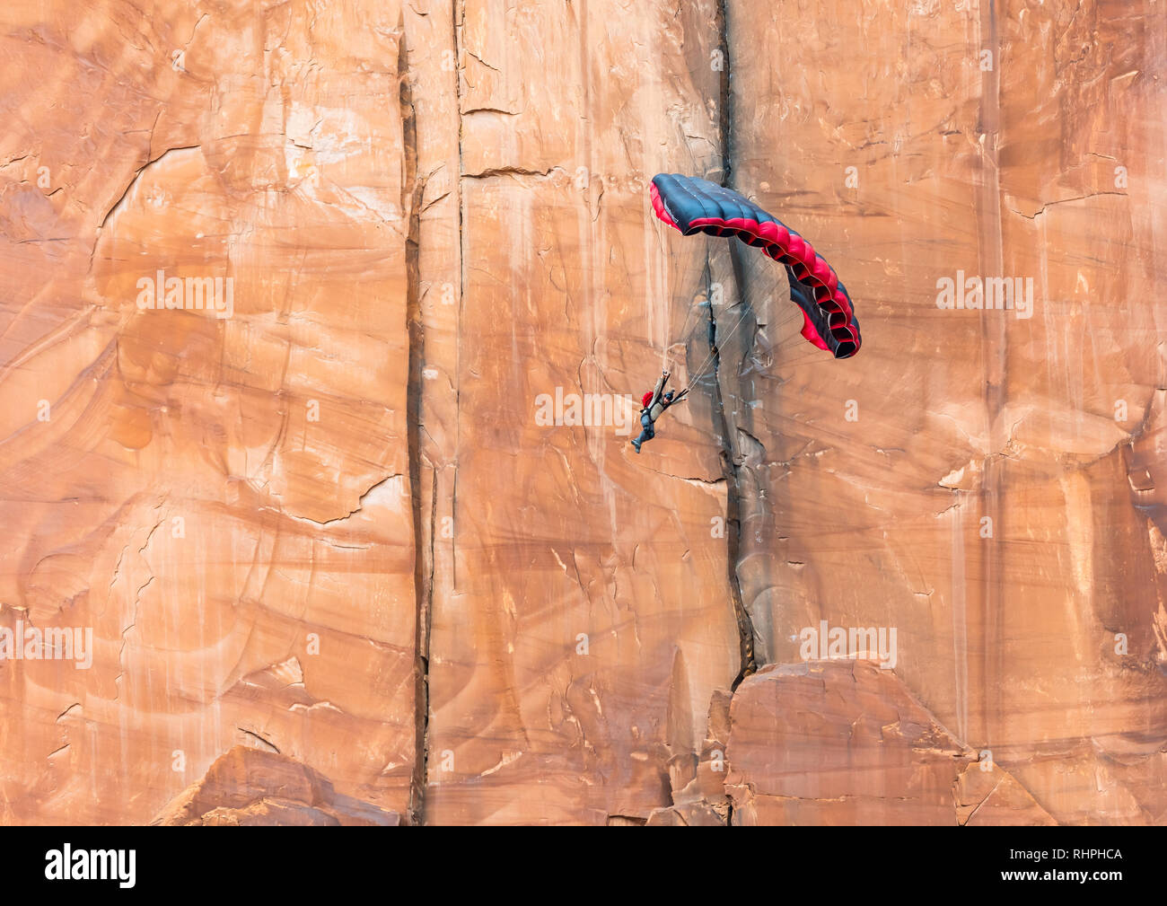 Aaron Stuyvenberg jumps from an exit point called Tombstone near Moab Utah Stock Photo