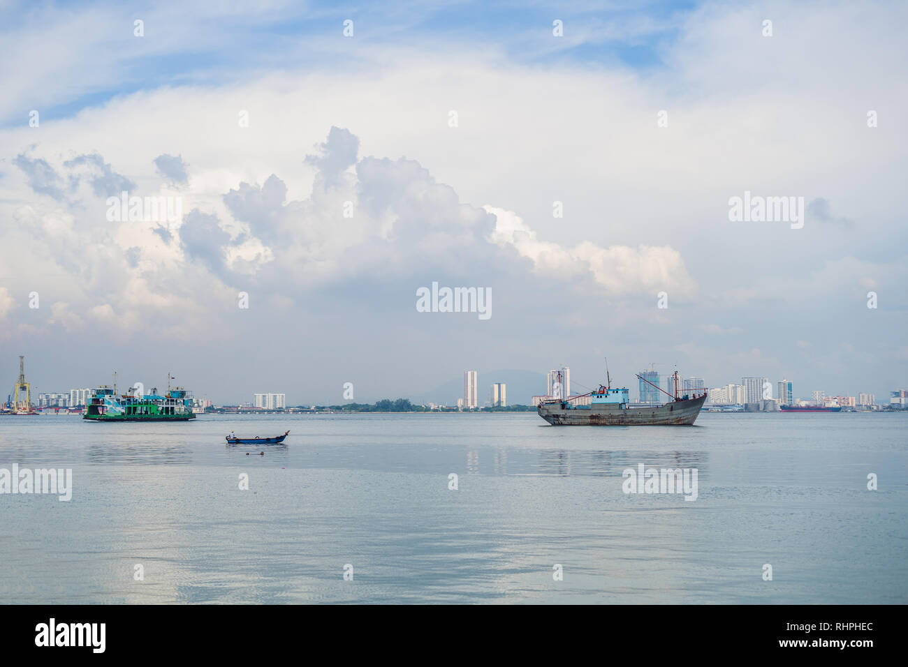 Cargo ship and ferry near the port in Penang, Malaysia Stock Photo Alamy