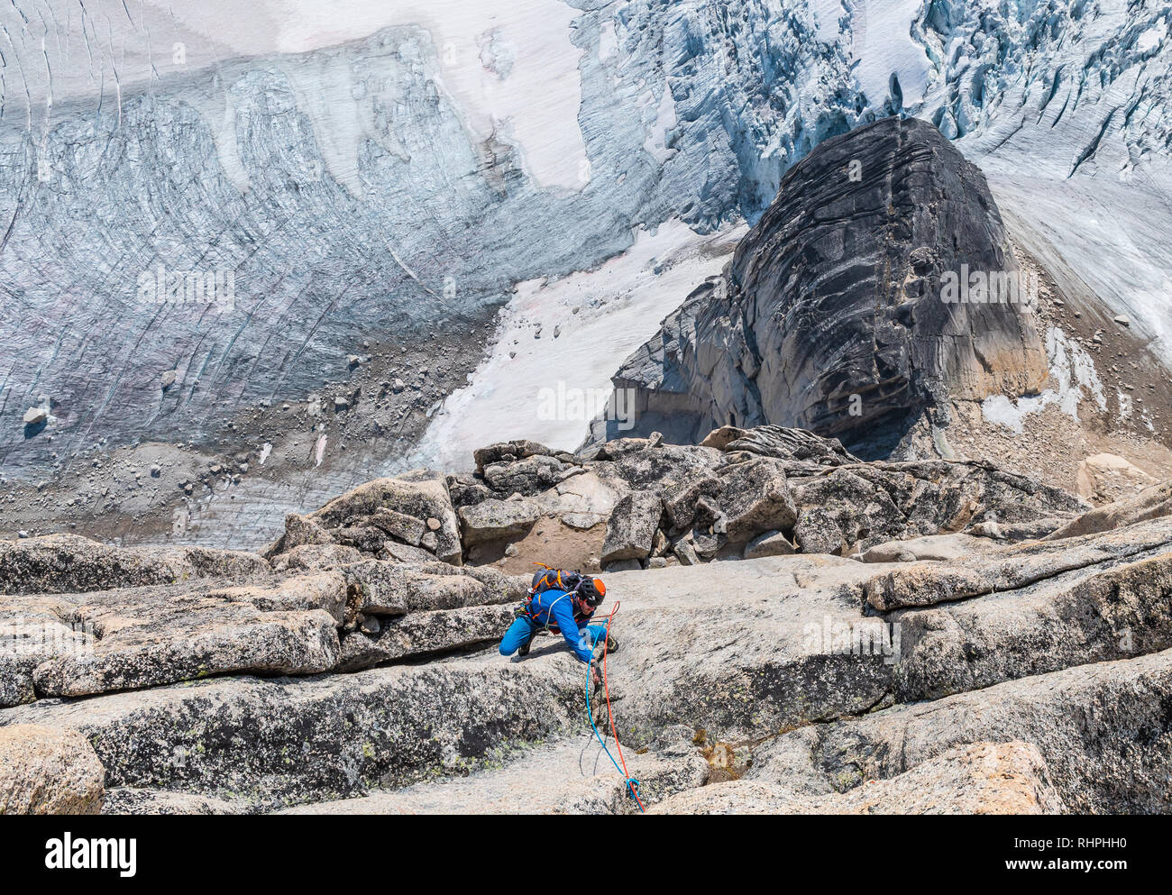 Brandon Prince and Nic Houser on a route called Surfs Up rated 5.9 on Snowpatch Spire in the Bugaboos Stock Photo