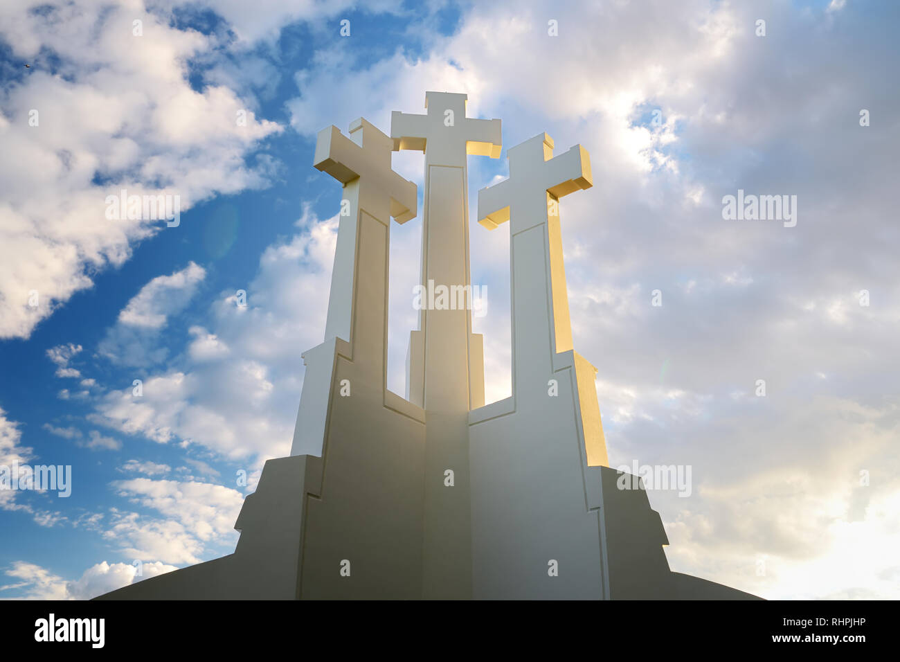 The Three Crosses monument overlooking Vilnius Old Town on sunset. Vilnius landscape from the Hill of Three Crosses, located in Kalnai Park, Lithuania Stock Photo