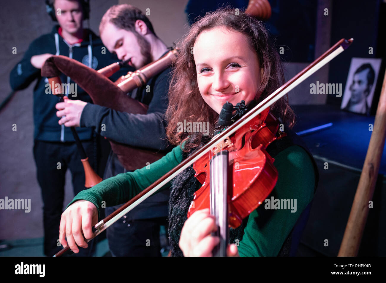 Musicians on stage, playing irish and scottish folk music. Blue Note, Poznan, Poland Stock Photo