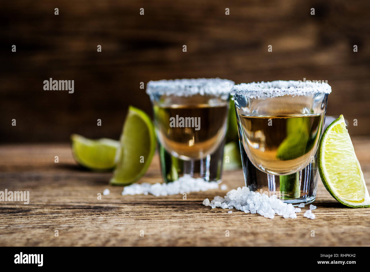 Mexican traditional alcohol drink Tequila with lime and salt and ice