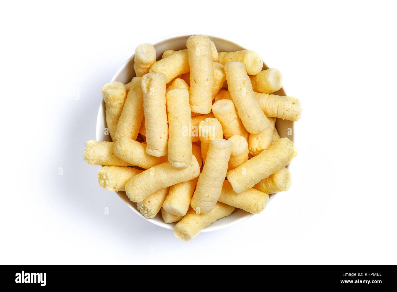 Puffelets Snack Crunchy corn puffs, pufuleti on bowl isolated over white. Romanian ...