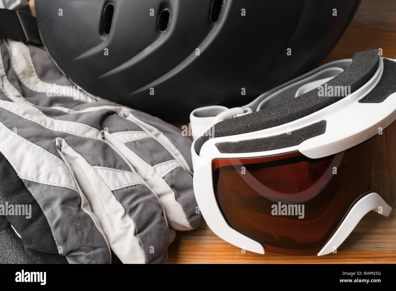 Snowboard or ski winter sports protective gear helmet, warm gloves