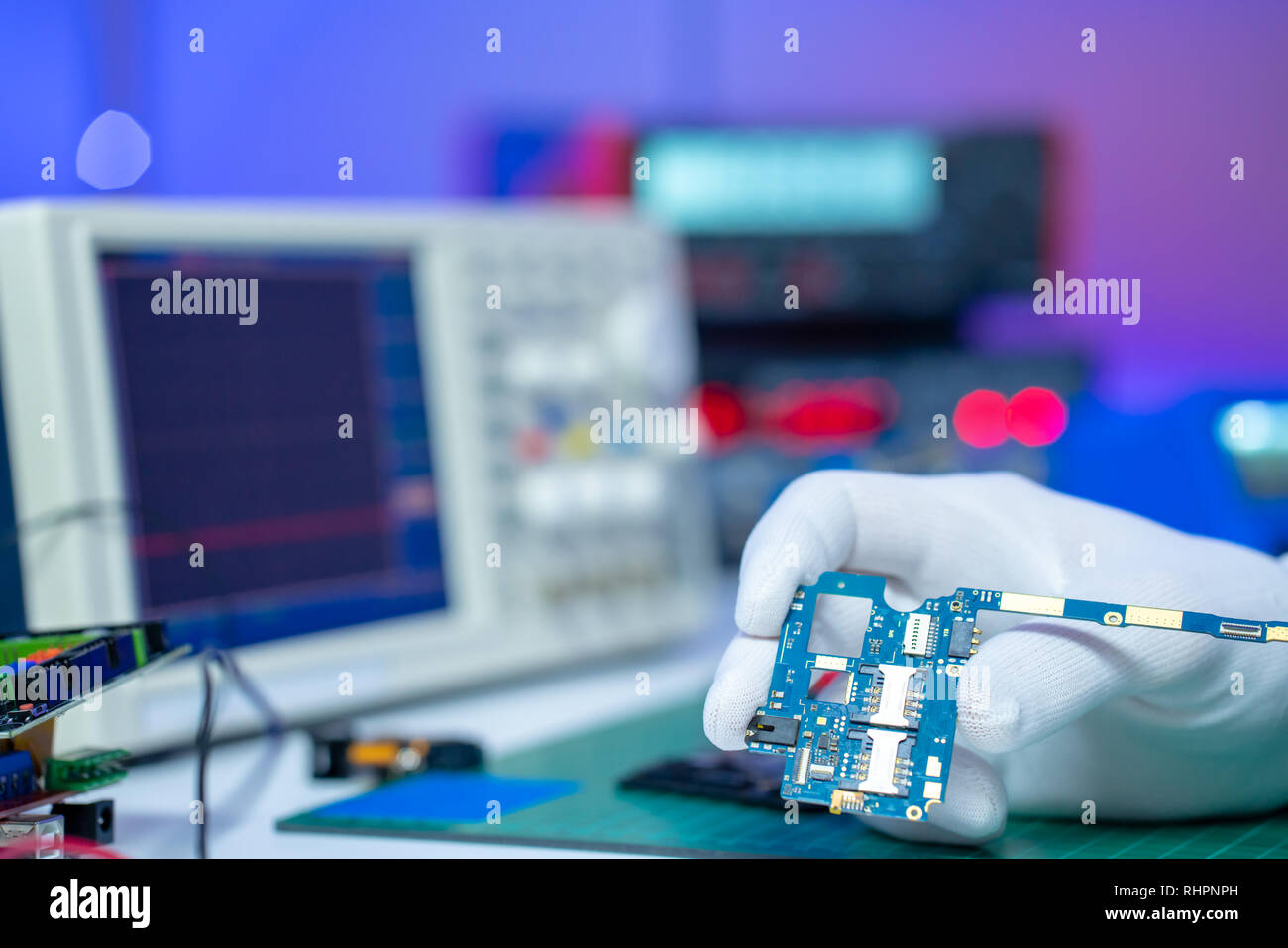 Fix of mobile phone in lab Stock Photo