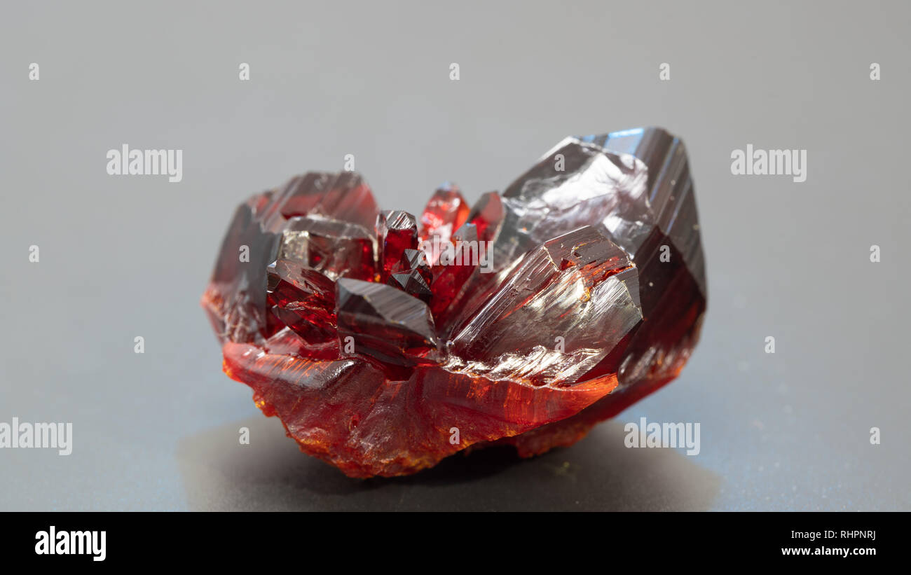 Natural raw red crystal. Natural red precious mineral stone Stock Photo