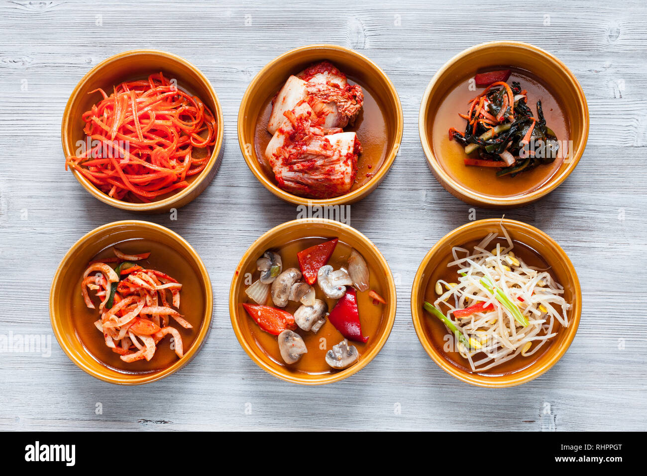 Korean signature Kimchi Stew in a hot ceramic pot served with other side  dishes Stock Photo - Alamy