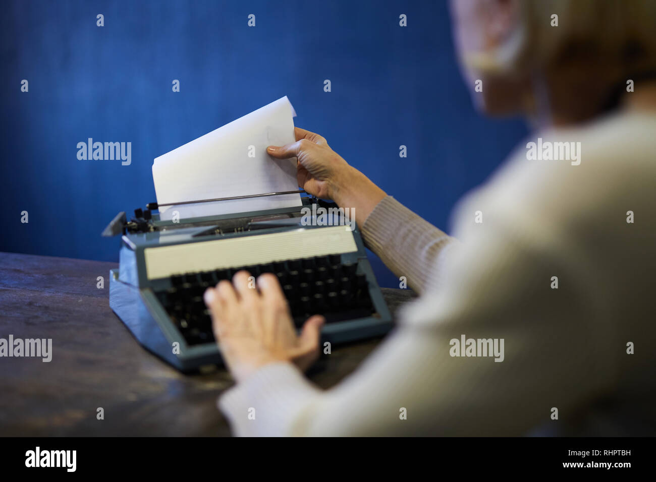 Novelist Using Typewriter Stock Photo