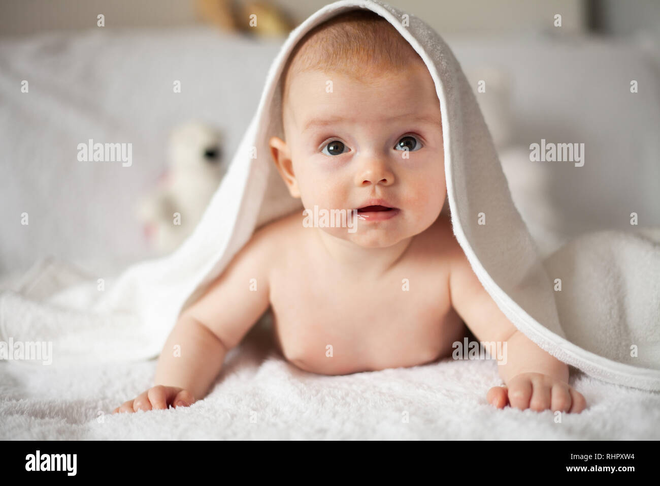 Kid hiding under blanket hires stock photography and images Alamy