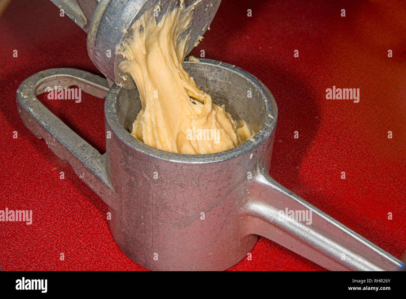 German noodle machine for spaetzle with dough Stock Photo