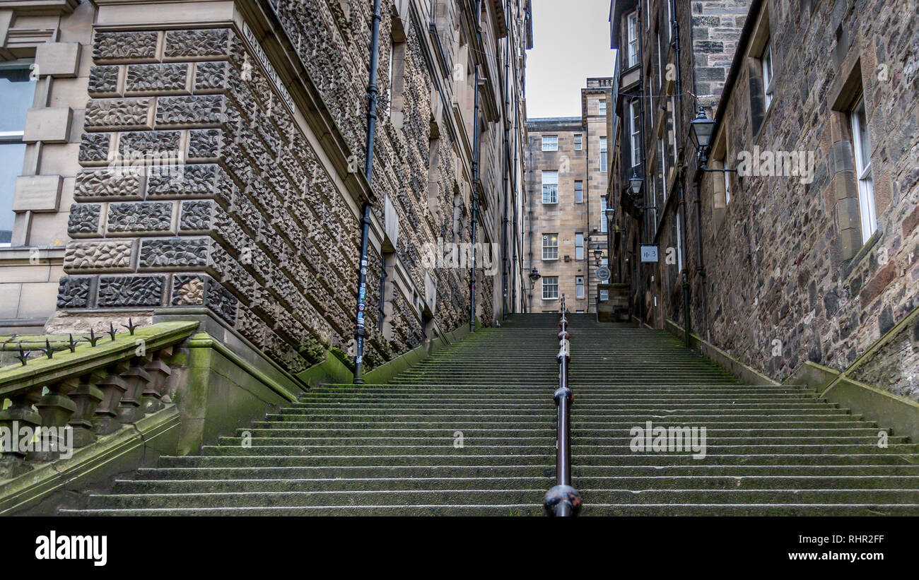 The countless Sandstone steps of Warriston Close connects Cockburn Street to the old town's Royal Mile in Edinburgh's fine architectural ancient city Stock Photo