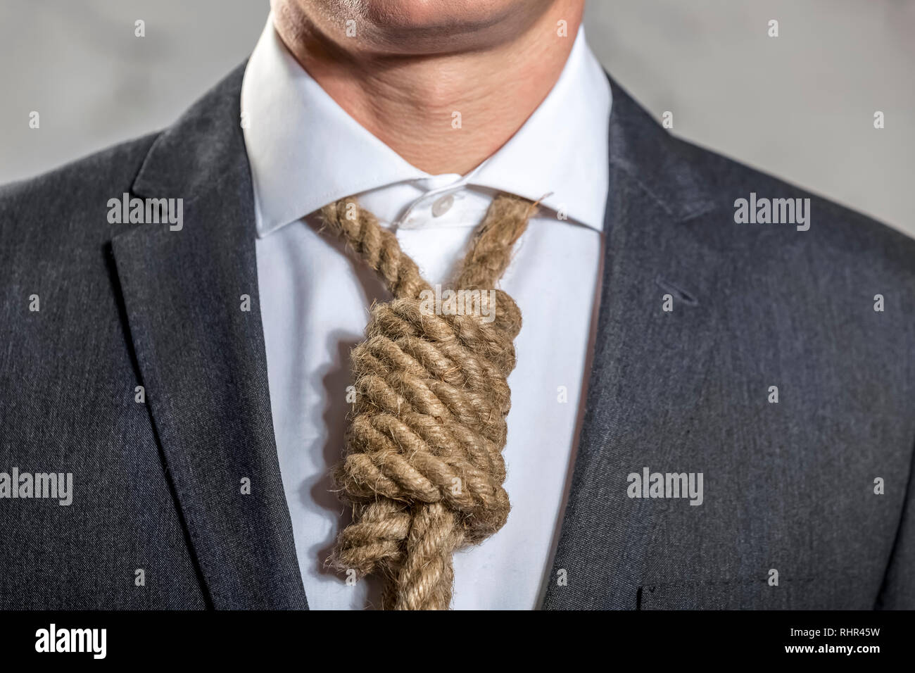 Midsection Of Businessman With Noose At Office Stock Photo