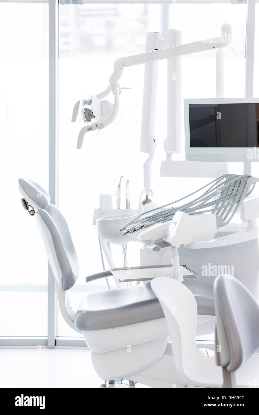 Dentist chair and equipment at dental clinic Stock Photo