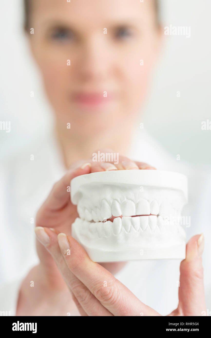 Dentist showing woman dentures hires stock photography and images Alamy