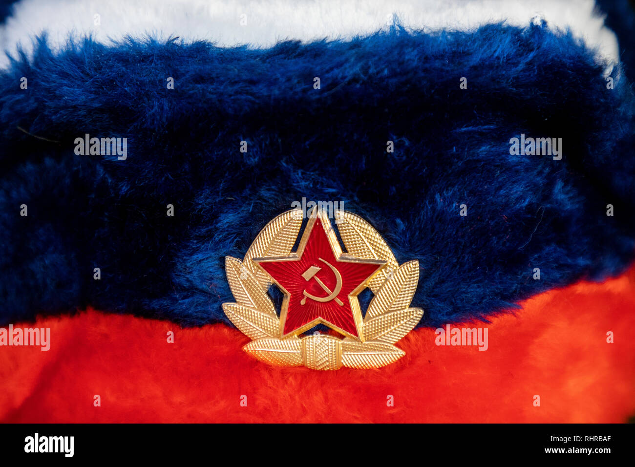Earflaps fur cap with red soviet star in a souvenir shop in Moscow, Russia Stock Photo