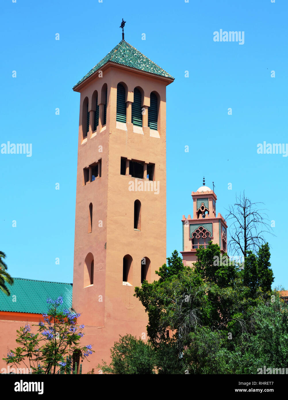 Two Minarets  The Saint Martyrs Church which was built under the french protectorate in 1928 is located opposite Gueliz Mosque. Marrakesh, Morocco. Stock Photo