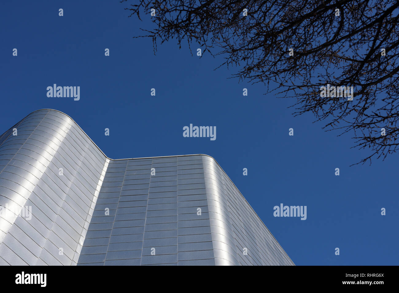 Modern building exterior with aluminium rainscreen cladding, sunlight ...