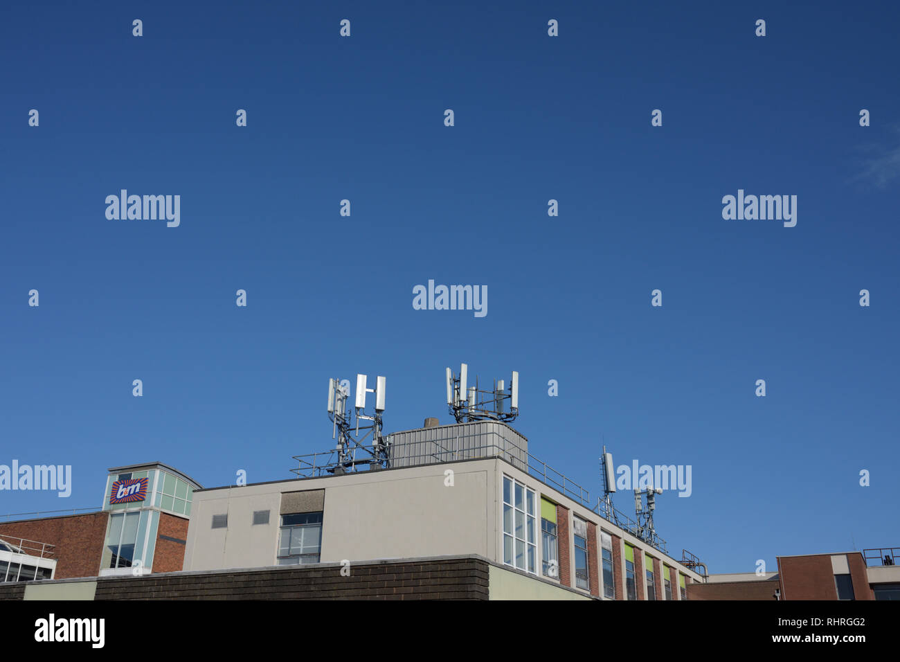 Mobile phone base stations mounted on building roof in bury lancashire