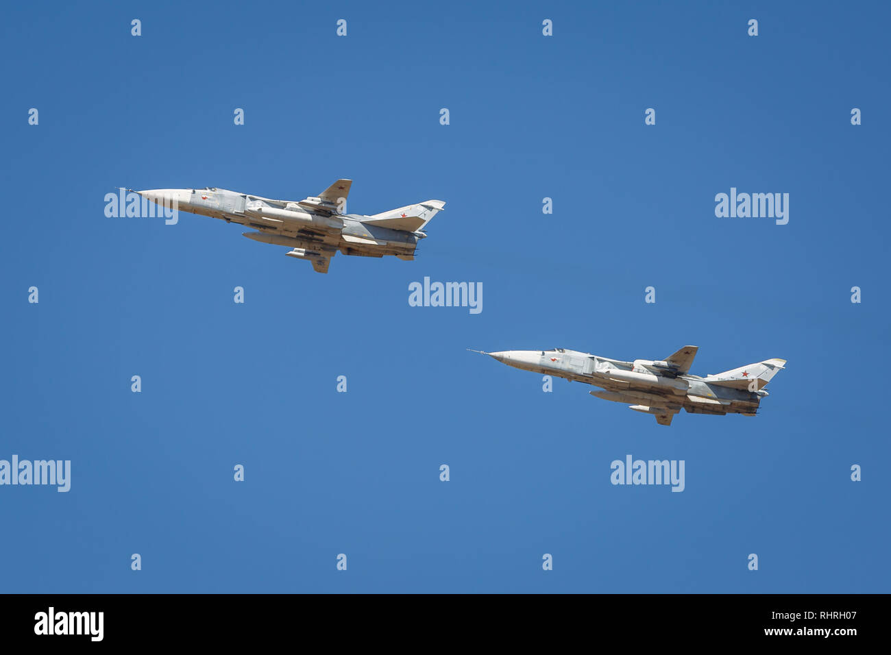 International military technical forum ARMY-2018. A pair of SU-24 aircraft perform demonstration flights in the sky over a military training ground Stock Photo