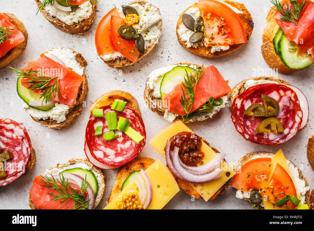 Assorted spanish tapas with fish, sausage, cheese and vegetables. White  background, frame food Stock Photo - Alamy
