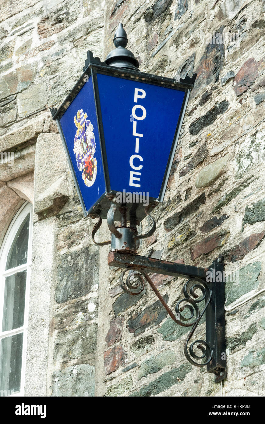 A traditional blue police lamp, close up, on the wall of a police station, Tavistock, UK Stock Photo