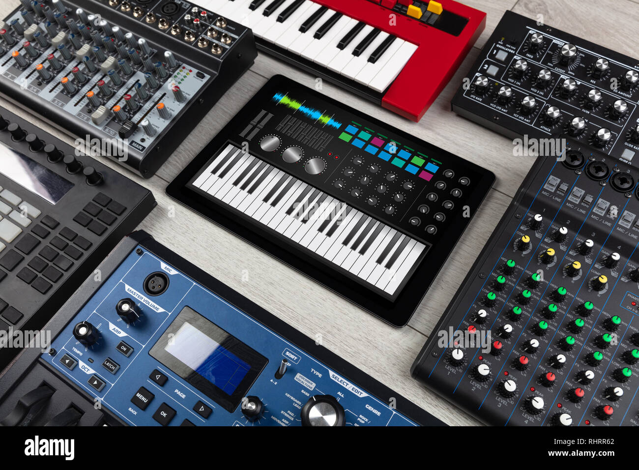 Piano synthesizer app on tablet and musical instrument concept Stock