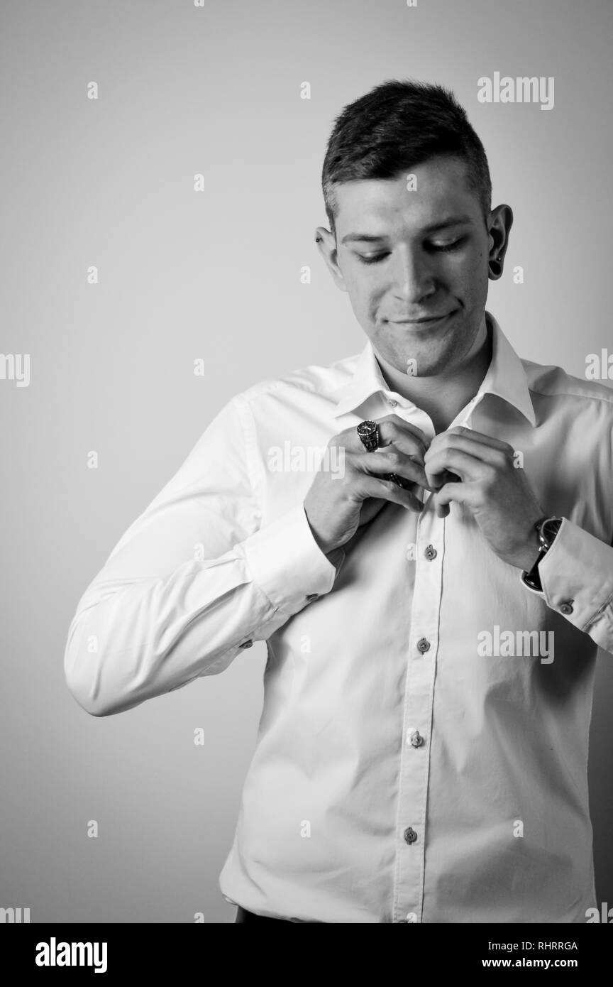 Portrait of confident young man in white shirt Stock Photo